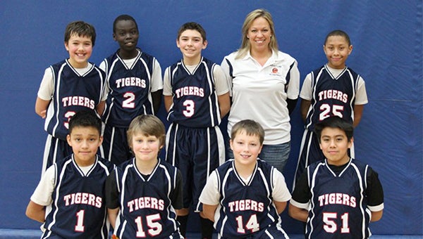 The Albert Lea sixth-grade B team took sixth place Dec. 16 at its home tournament. Front row from left are Ismail Cabazas Jr., Malachi Loyd, Carson Smith and Hector Guerrero. Back row from left are Andrew Willner, Pinyon Remg, Braden Kraft, coach Erica Smith and Javarus Owens. Jose Zeferino is not pictured. — Submitted