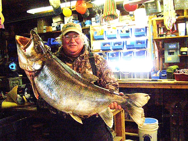 Rob Scott of Crane Lake with a 52-pound 3-ounce lake trout he caught through the ice while fishing Lac la Croix on the Minnesota-Ontario border. The fish was caught about 100 feet onto the Ontario side of the lake. If caught in Minnesota, it easily would have been a state record. -- MCT