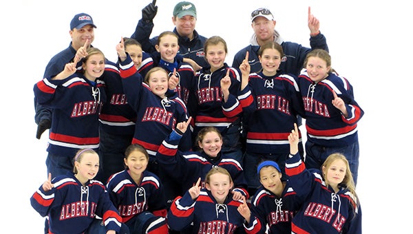 The Albert Lea U10 girls’ hockey team finished the season Sunday by winning the Eden Prairie Meltdown, a three-day tournament. Front row from left are Josie Venem, Allison Dulitz, Laynee Behrends, Maddie Schneider, Esther Yoon and Jaiden Venem. Middle row from left are Lucy Sherman, Delani Hernandez, Sadie Neist, Lauren Cookle, Mia Fjelsta, Ally Rasmussen and Taylor Stanek. Back row from left are coaches Brad Fjelsta, Dan Rasmussen and Troy Neist. — Submitted