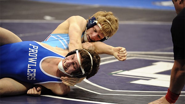 Devin Nelson of Albert Lea gets Austin Hjelle of Thief River Falls in a hold Friday in the first round of the Class AA state wrestling tournament at 138 pounds. — Micah Bader/Albert Lea Tribune