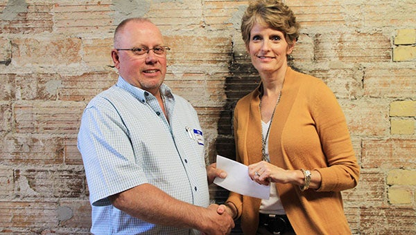 Freeborn County Communities Foundation chairwoman Jill Peterson, right, shakes hands with Fountain Lake Sportsmen’s Club member Larry Anderson. He also serves as an Albert Lea city councilor. -- Submitted