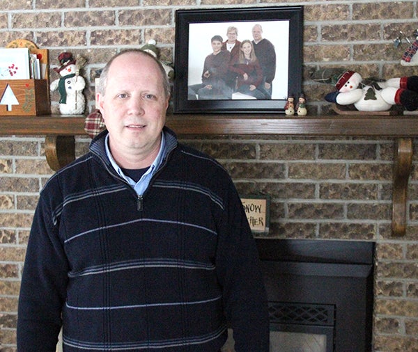 Jim Haney stands in the living room of his Skylark Lane home in Albert Lea. Haney, a native of North Dakota, teaches government and social studies at Albert Lea High School. -- Drew Claussen/Albert Lea Tribune 
