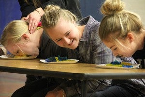 Girls participate in the jello eating contest. – Tiffany Krupke/Albert Lea Tribune