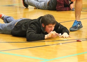 A students uses a noise maker to get a toy car to half court during the Ag Olympics. – Tiffany Krupke/Albert Lea Tribune