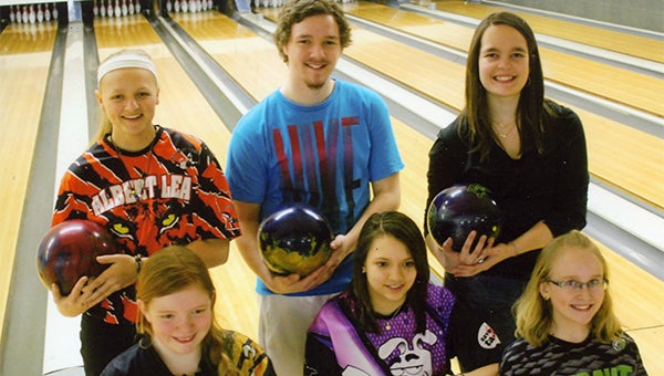 The top three winners of two divisions of the five-game Youth Scratch Sweeper tournament stand at Holiday Lanes in Albert Lea. Bowlers in the 161 and over division are in the back row. From left are Bree Tlamka, first place; Elijah Rayman, second place; and Brianna Oftedahl, third place. Bowlers in the 160 and under division are in the front row. From left are Bethany Hiniker, first place; Beth Gonzalez, second place; and Emmy Benway, third place. The top three bowlers in each division received money to be used toward education. — Submitted
