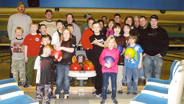 Members of the Saturday Morning Pepsi Youth League stand at Holiday Lanes. The season will last until April. — Submitted