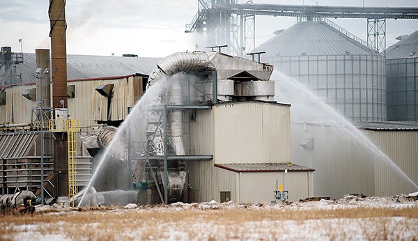 Fergus Falls firefighters spray water on a dryer at the Otter Tail ethanol plant owned by Green Plains Renewable Energy. – Heather Rule/Albert Lea Tribune