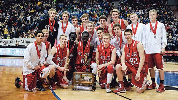 The Austin Packers with their Class AAA runner-up plaque Saturday night in Target Center. – Eric Johnson/Albert Lea Tribune