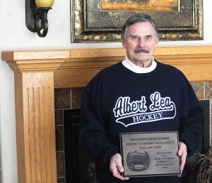 Roy Nystrom holds the plaque presented to him when he was inducted into the Minnesota High School Hockey Association’s Hall of Fame. Nystrom is the second-winningest high school coach in Minnesota. — Drew Claussen/Albert Lea Tribune