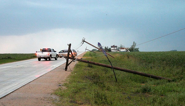 Fallen power lines befuddle drivers on Freeborn County Road 46 immediately following the passing of tornadoes on June 17, 2010. – Tim Engstrom/Albert Lea Tribune