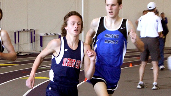 Jackson Goodell, left, of Albert Lea competes in the 1,600-meter run Tuesday at the University of St. Thomas in Minneapolis. Goodell won the event in 4 minutes, 57 seconds. — Lon Nelson/For the Albert Lea Tribune