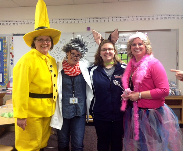 Hawthorne Elementary School teachers Ruth Berg, Jill Petersen, Jenna Miller and Molly Neumann dress up as book characters during a recent school book swap. Book swaps are literacy events to encourage reading outside of school. --Submitted
