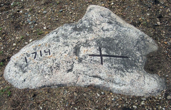 It’s somewhat hard to detect the cross and date of 1714 on the granite rock in the yard at the Dillavou farm about six miles south of Albert Lea. However, with the help of chalk the still obvious grooves in the rock can be enhanced for better viewing. Who took the time to etch the cross and date in the rock almost 300 years ago is now completely unknown.  --Ed Shannon