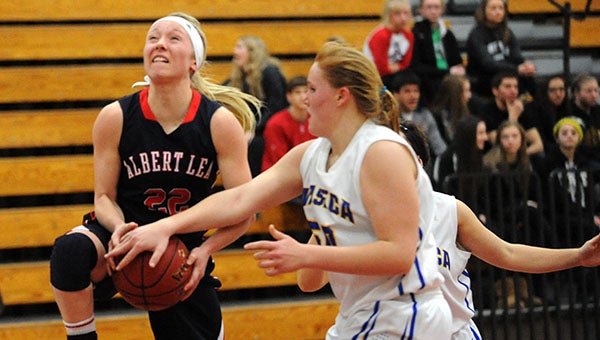 Albert Lea's Bryn Woodside gets fouled on her way up for layup during Wednesday's Section 1AAA victory over Waseca. — Drew Claussen/Albert Lea Tribune