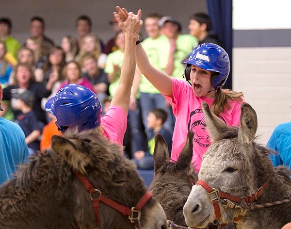 Members of the Glenville All-Stars celebrate a basket Tuesday during the Glenville FFA Donkey Basketball Tournament at Glenville-Emmons High School. – Colleen Harrison/Albert Lea Tribune