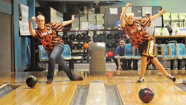 Brianna Oftedahl, left, and Bree Tlamka of Albert Lea practice Thursday for the South Central Conference girls’ bowling tournament. Albert Lea already qualified for the state tournament by finishing first place in the conference at the conclusion of the regular season. — Micah Bader/Albert Lea Tribune