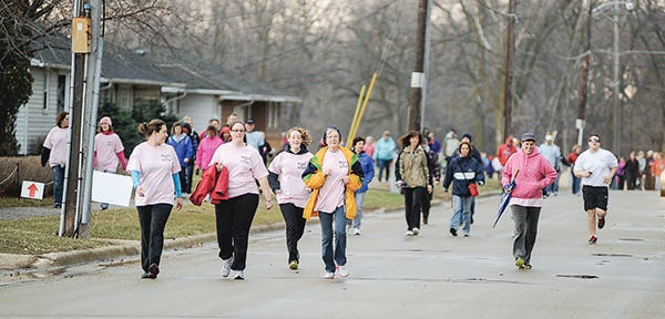 Participants in the 2014 March of Dimes March for Babies make their way toward The Hormel Institute Saturday morning.  – Eric Johnson/Austin Daily Herald