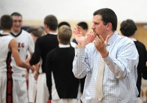 NRHEG boys’ basketball coach Pat Churchill celebrates a come-from-behind victory Dec. 17 at United South Central. The Panthers won 68-67. — Micah Bader/Albert Lea Tribune