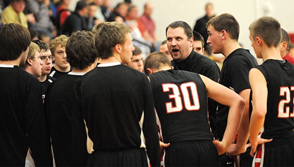 NRHEG boys’ basketball head coach Pat Churchill instructs his team during a timeout Jan. 13 during a 75-64 home win against St. Clair. Churchill led the Panthers to a 19-7 overall record and a Gopher Conference title this season. — Drew Claussen/Albert Lea Tribune