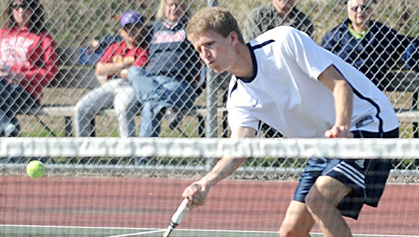 Collin Jahnke plays a ball near the net in his doubles match Tuesday against Rochester John Marshall. — Drew Claussen/Albert Lea Tribune