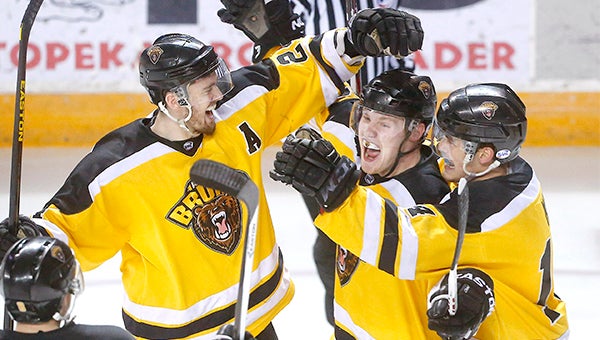The Austin Bruins celebrate after Brian Bachnak gives them a 2-0 lead over Topeka early in the second period during last Saturday night’s game at the Kansas Expocentre. — Chris Neal/The Capital-Journal