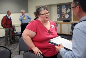 Colleen Towns of Brooklyn Park talks with Tim Mikkelson of Bloomington during the Job Transition Support Group at Wooddale Church in Eden Prairie on Monday. – Jeffrey Thompson/MPR News 