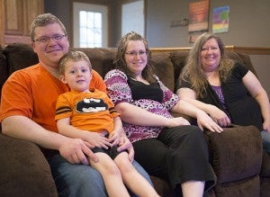 From left, Sean, Gabriel and Leslie Willaby and Leslie’s mother, Kari Baseman, pose for a photo in the Willabys’ Glenville home. Baseman took care of Gabriel when his parents were both deployed overseas. -- Colleen Harrison/Albert Lea Tribune