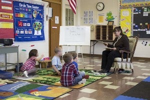Sue Amundson, St. Theodore’s Catholic school principal, reads a story to the pre-kindergarten class at the end of the school day. – Hannah Dillon/Albert Lea Tribune