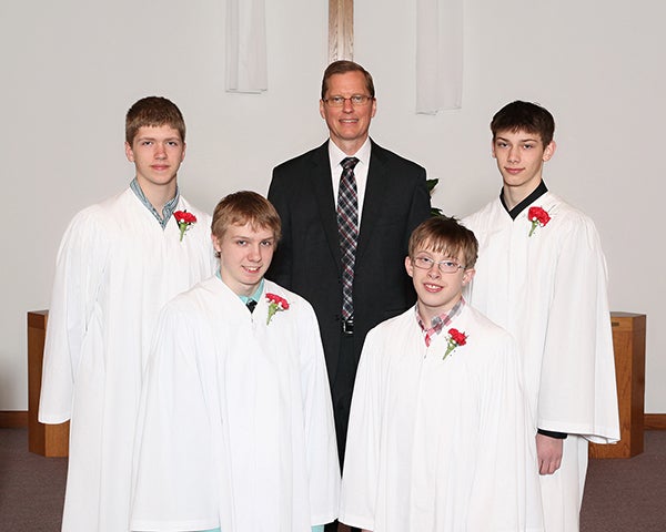 The confirmation class at Faith Lutheran Church of London on May 4.  Pictured are (back row): Brady Jahr, the Rev. Kent Otterman and Dylan Gooder; (front row) Christian Bublitz and Jacob Bublitz. – Provided