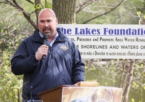 David Anglum with Anheuser-Busch speaks Friday during a ceremony at Frank Hall Park in which the company awarded the Lakes Foundation of Albert Lea with a $50,000 grant.  — Sarah Stultz/Alert Lea Tribune