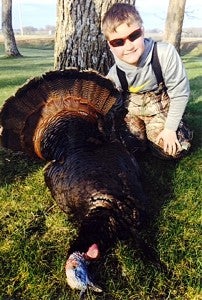 Alex Nielsen, 8, of Albert Lea shot his first turkey in Freeborn County on May 10. The bird weighed 25 pounds and had a 9 1/4-inch beard and 1/4-inch spurs. — Provided