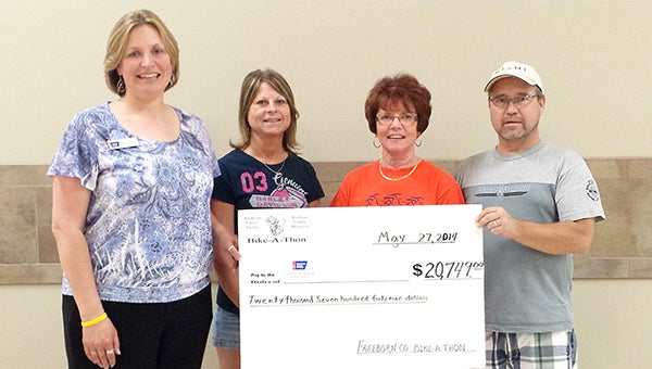 Organizers of the Freeborn County Bike-A-Thon present the American Cancer Society with a check for $20,749. From left are, Sarah Finley, a representative of the American Cancer Society and Jody Dreyling, LeAnn Juveland and Ken Dreyling of the bike-a-thon committee. Cyclists participated in some or all of the 100-mile bike ride on May 3. – Provided