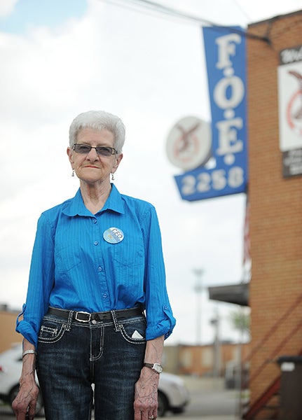 Lou Miller stands outside of her apartment, which is above the Albert Lea Eagles Club at 205 W. William St., where she bartended for 40 years. – Micah Bader/Albert Lea Tribune