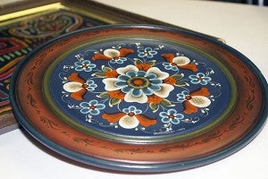This piece of Norwegian rosemaling is just one of the pieces that will be sold at the Unique Junque sale. – Hannah Dillon/Albert Lea Tribune