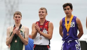 T.J. Schiltz of NRHEG stands on the podium for his sixth-place finish Saturday in the 1,600-meter run at the Class A state track meet at Hamline University. Austin O’Hare of Rushford-Peterson, left, and Ian Torchia, right, also received medals. — Jacob Tellers/Albert Lea Tribune