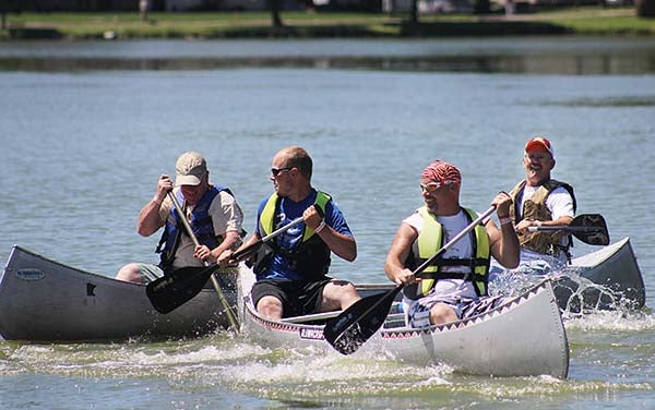 Chad Mattson and Kory Newman, in the front canoe, collide with Jim Buckley and Al Monson in a second canoe during the canoe races at Alden’s Morin Lake Days on Saturday. – Sarah Stultz/Albert Lea Tribune