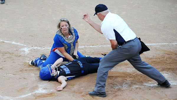 Kayla Branstad of Northwood-Kensett tags North Iowa runner Rachel Hassebroek out at home plate Monday during the first round of the Class 1A, Region 2 playoffs at Northwood. — Jacob Tellers/Albert Lea Tribune