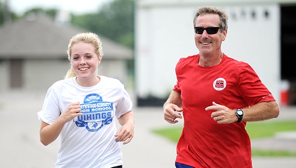 Hannah Hunchis, left, runs Saturday during the Firecracker 5K Walk/Run with her father, John Hunchis, in Northwood. The duo ran the event together for the second straight year. — Micah Bader/Albert Lea Tribune