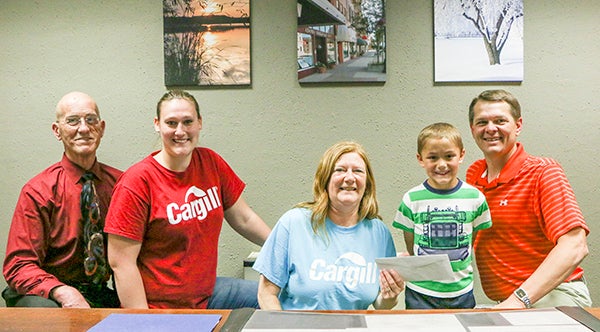 The third annual Open Streets: A Day of Play was held last month. Kids were encouraged to sign up to win $100 in Chamber bucks toward a new bike courtesy of Cargill. Layton Yost of Albert Lea was the winner. Pictured with Yost, from left, is National Vitality Center director Randy Kehr, Cargill representatives Martha Conway and Wanda Wrolson, and Mayor Vern Rasmussen, Jr. Yost is the son of Richard and Amber Yost of Albert Lea. – Provided