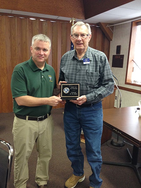 Daybreakers Kiwanis president Mike Funk presents member Dick Polley with the Kiwanian of the Month award at a recent Daybreakers Kiwanis meeting. – Provided