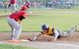 Slade Sifuentes of Lake Mills safely dives back to first base to avoid being picked off in the Class 1A, District 4 semifinals at Lake Mills. — Jacob Tellers/Albert Lea Tribune
