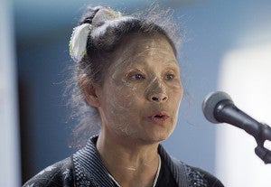 Pah Mu speaks during a Karen Sunday worship service July 17. Mu had a paste made from tree bark on her face to keep her cool and to protect her skin from the sun, she said through an interpreter. – Colleen Harrison/Albert Lea Tribune