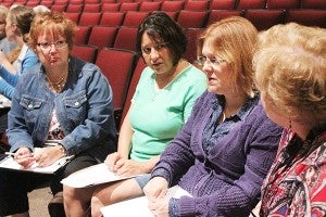 From left, Linda Holst, Michelle Pink, Rita Drescher and Carol Bosma talk Wednesday during a workshop with nationally known speaker Jodi Pfarr at the launch of the Leaders Partnering to End Poverty program at Albert Lea High School. – Sarah Stultz/Albert Lea Tribune