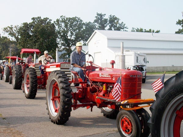 Sheldon Skaar rides his grandfather’s tractor in the yearly Shinefest Tractor event July 19 at the Freeborn County Fairgrounds. – Provided