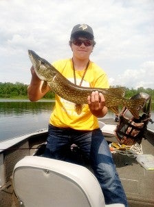 Dylan Herfindahl holds a pike he caught June 17 while trolling one of the many small lakes in the Marcell area. — Dick Herfindahl/Albert Lea Tribune