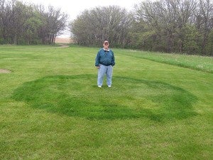 Jerry Peichel of Fairfax stands inside a naturally occurring fairy ring of mushrooms. Jerry is no elf, but folklore says this is a place where elves dance. – Al Batt/Albert Lea Tribune