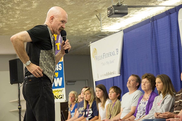 Terry DaVolt explains the hypnosis process to the volunteers during his show on Wednesday. – Hannah Dillon/Albert Lea Tribune