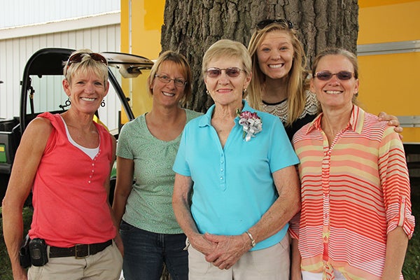Bernice “Perk” Monson, center, stands with family members Wednesday before being recognized  as the 2014 Outstanding Senior Citizen at the Freeborn County Fair. From left are Nellie VanEngelenburg, daughter, Barb Buckley, daughter, Bernice Monson, Chrissy Monson, granddaughter, and Deb Monson, daughter-in-law. – Sarah Stultz/Albert Lea Tribune