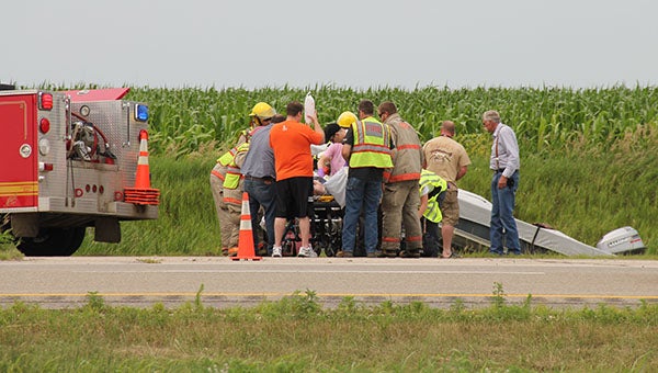 First responders respond to Richard Story's injuries Saturday near the vacant weigh station about a mile south of the Clarks Grove interchange of Interstate 35.