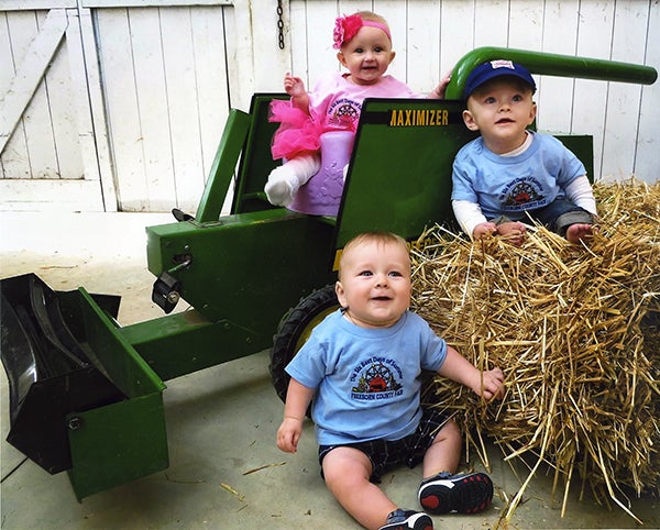 From left, Sadie Nielsen, 5 months; Abe Irvine, 7 months; and Teddy McGill, 7 months, are all grandchildren of long-time Freeborn County Fair board members. – Provided